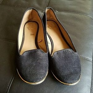 black flats with gold trim